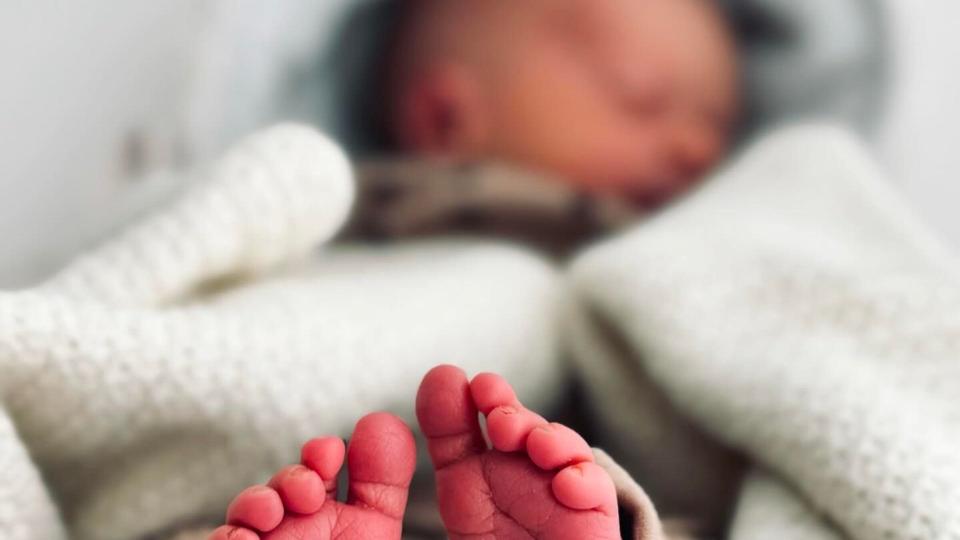 baby Madison with feet near camera