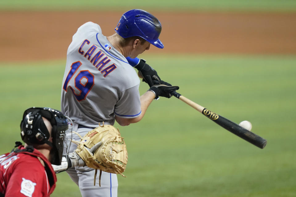 New York Mets' Mark Canha (19) grounds out to score Starling Marte during the fourth inning of a baseball game against the Miami Marlins, Saturday, June 25, 2022, in Miami. (AP Photo/Lynne Sladky)