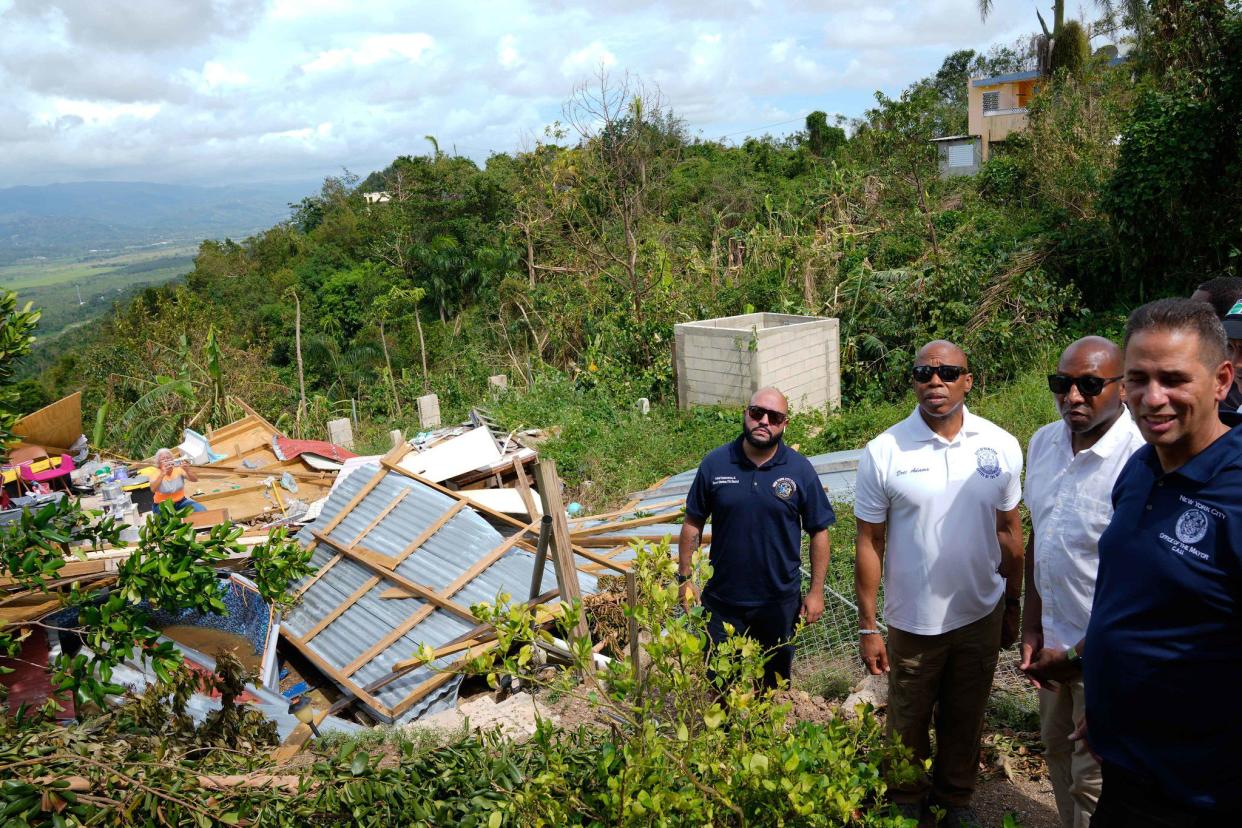 New York City Mayor Eric Adams tours a village outside of Cabo Rojo, Puerto Rico, which was damaged by Hurricane Fiona, on Sunday, September 25, 2022.