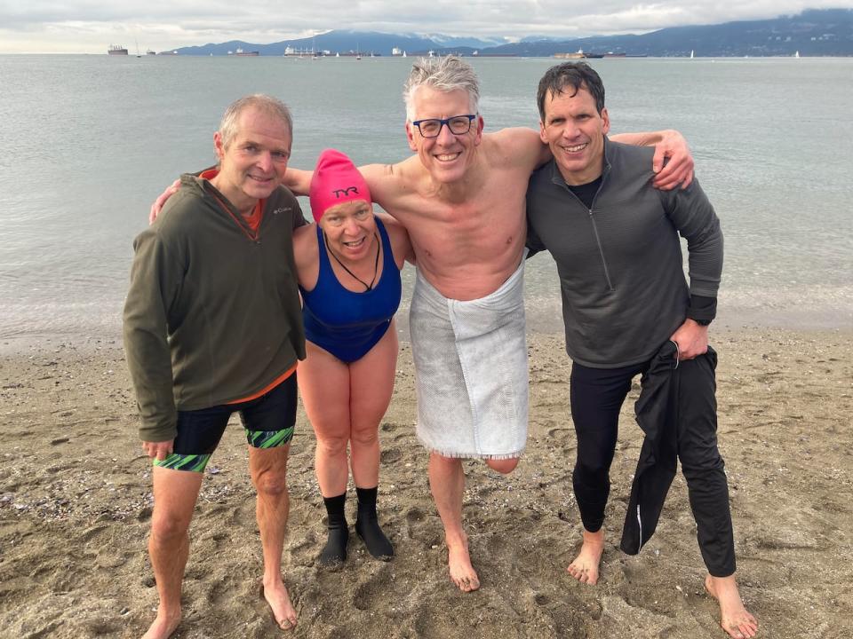 Jim Boothroyd, second from right, and fellow Hillcrest Aquatic Centre swimmers Séamus Parker (L), Lis Jang, and John Downing, after polar bear swim at Kitsilano Beach in Vancouver in January 2023. Boothroyd says the 50-metre swimmers are a close group and the lane closures are deterring people from continuing to swim.