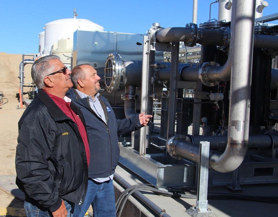 Victor Valley Wastewater Reclamation Authority General Manager Darron Poulsen, right, gives Assemblyman Thurston “Smitty” Smith a tour of Anaergia's gas conditioning facility that will turn methane or biogas into renewable natural gas at the VVWRA site in Victorville.