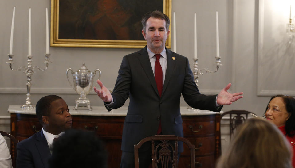 Virginia Gov. Ralph Northam, top center, greets members of the Richmond 34 and other African-American leaders for a breakfast at the Governors Mansion at the Capitol in Richmond, Va., Friday, Feb. 22, 2019. The Richmond 34 were a group of African Americans who defied segregation laws in the 1960's (AP Photo/Steve Helber)