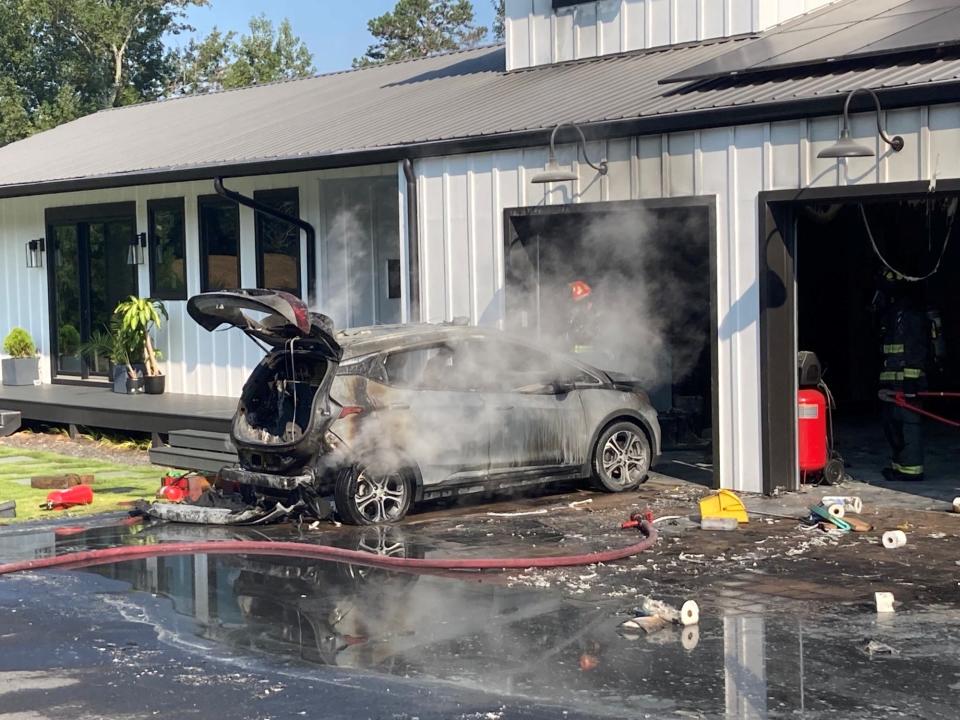 The scene on Sept. 13, 2021 of a 2019 Chevrolet Bolt on fire at a home in Georgia, just north of Atlanta. The fire report read: "The fire appeared to be coming from a 2019 Chevy Bolt electric vehicle.  The vehicle was pulled from the garage; however, it had already received extensive damage.  Another vehicle inside the garage, a 2017 Dodge Ram, received some smoke damage."
