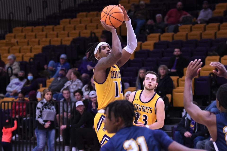 Hardin-Simmons' Steven Quinn (14) goes up for a shot during Thursday's American Southwest Conference game against East Texas Baptist at the Mabee Complex. Quinn scored a career-high 31 points as the Cowboys snapped a three-game losing streak with the 84-75 victory.