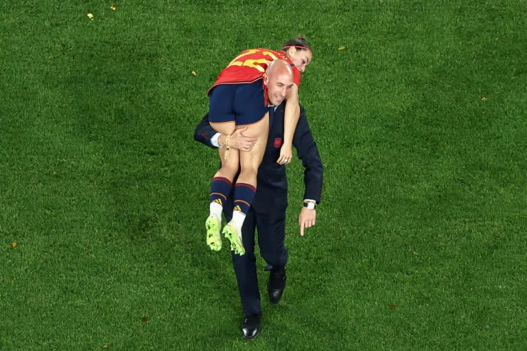 Spanish football federation chief Luis Rubiales carries player Athenea del Castillo after Spain won the Women's World Cup in Australia (David Gray)