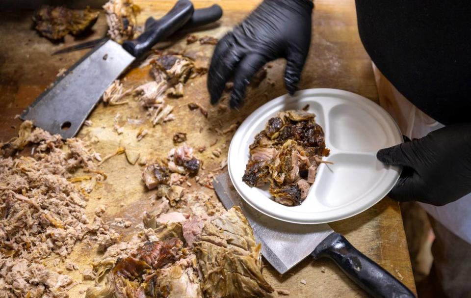 At Lexington Barbecue, a plate of course chopped barbecue is prepared in the kitchen on Tuesday, October 10, 2023 in Lexington, N.C.