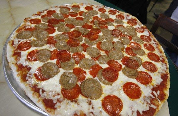 An Italian sausage and pepperoni pizza at Falcone's Pizzeria and Deli in Oklahoma City.