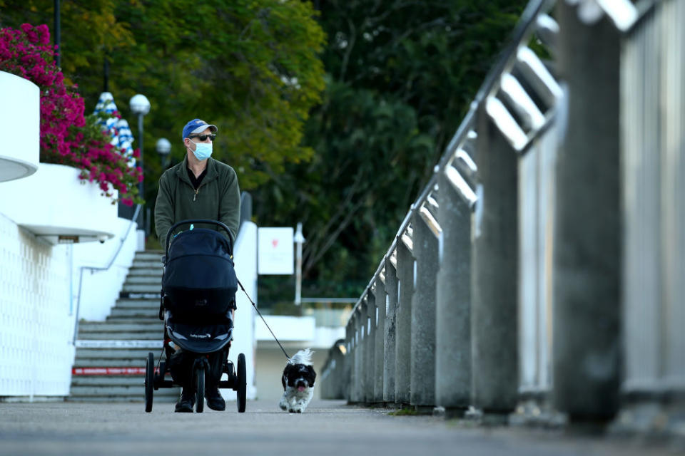 People are seen walking near the Brisbane CBD after lockdown.