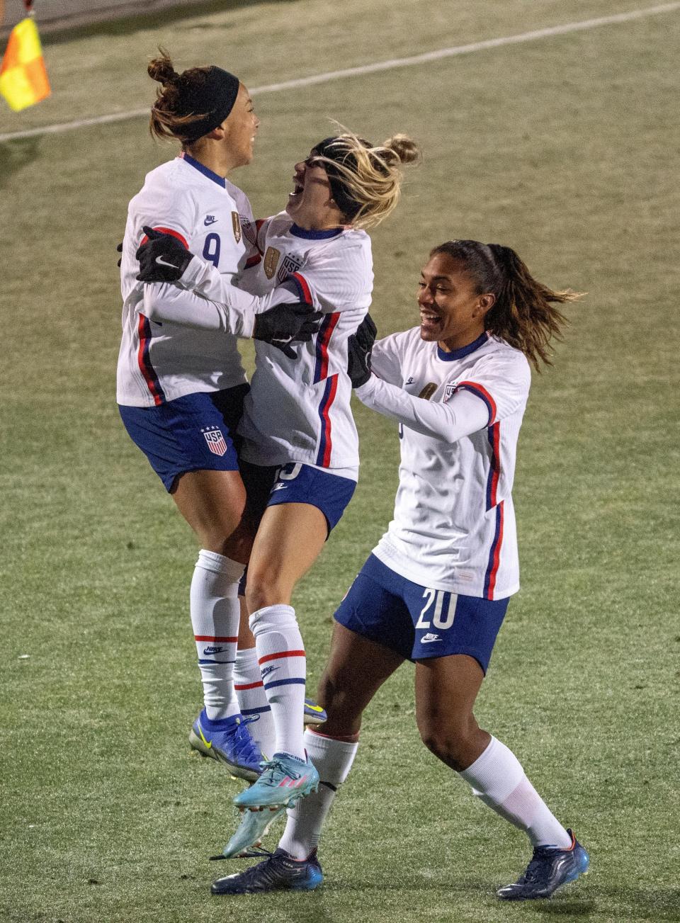 United States' Mallory Pugh (9) celebrates with Ashley Sanchez, middle, and Catarina Macario (20) after scoring a goal against Iceland during the second half of a SheBelieves Cup soccer match Wednesday, Feb. 23, 2022, in Frisco, Texas. The United States won 5-0. (AP Photo/Jeffrey McWhorter)