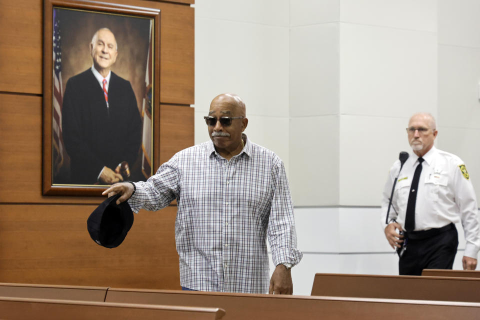 Former Marjory Stoneman Douglas High School campus monitor Elliot Bonner waves at someone in the courtroom gallery as he enters to testify during the trial of former MSD School Resource Officer Scot Peterson at the Broward County Courthouse in Fort Lauderdale, Fla., on Tuesday, June 20, 2023. Broward County prosecutors charged Peterson, a former Broward Sheriff's Office deputy, with criminal charges for failing to enter the 1200 Building at the school and confront the shooter. (Amy Beth Bennett/South Florida Sun-Sentinel via AP, Pool)