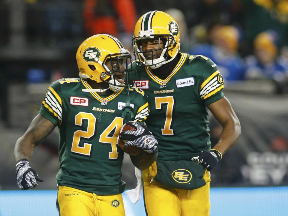 Edmonton Eskimos' Akeem Shavers (L) is congratulated by teammate Kenny Stafford (7) after scoring a touchdown against the Ottawa Redblacks in the second quarter during the CFL's 103rd Grey Cup championship football game in Winnipeg, Manitoba, November 29, 2015. REUTERS/Mark Blinch