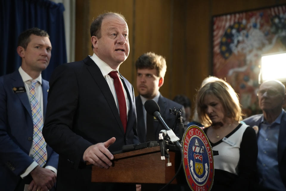 Colorado Gov. Jared Polis speaks before signing four gun control bills, Friday, April 28, 2023, in the State Capitol in Denver. (AP Photo/David Zalubowski)