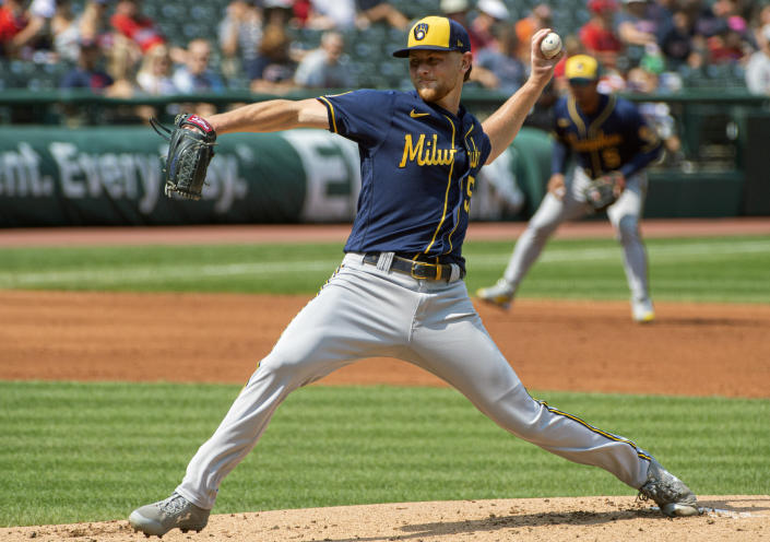 Milwaukee Brewers starting pitcher Eric Lauer delivers against the Cleveland Indians during the second inning of a baseball game in Cleveland, Sunday, Sept. 12, 2021. (AP Photo/Phil Long)