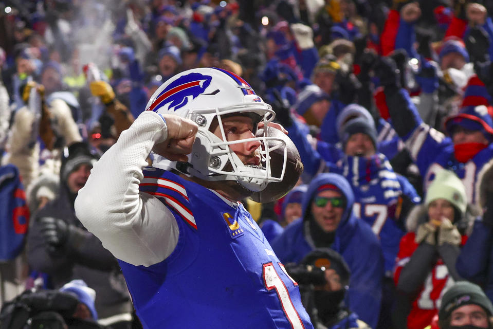 Buffalo Bills quarterback Josh Allen (17) reacts to the crowd after scoring a touchdown against the Pittsburgh Steelers during the second quarter of an NFL wild-card playoff football game, Monday, Jan. 15, 2024, in Buffalo, N.Y. (AP Photo/Adrian Kraus)