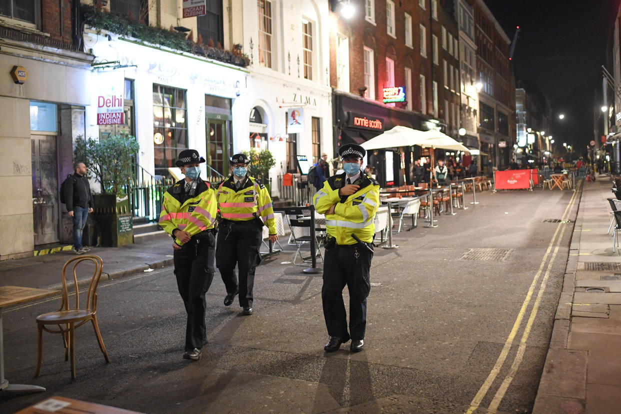 LONDON, ENGLAND - SEPTEMBER 24: Police officers patrol in Soho on September 24, 2020 in London, England. Pubs, cafes and restaurants will have to shut at 10pm every night under new measures to control the rising rate of coronavirus. (Photo by Peter Summers/Getty Images)