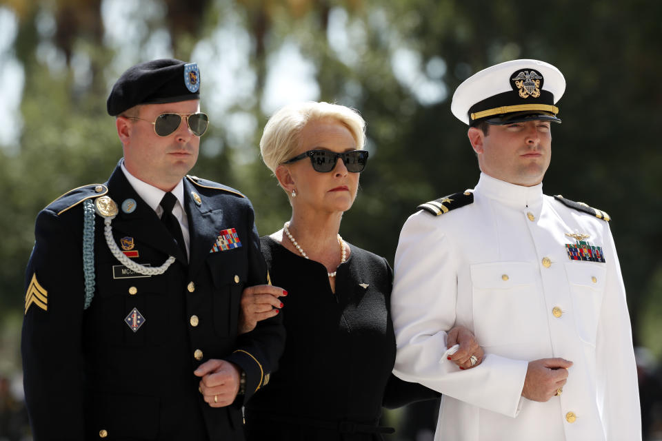 <p>Cindy McCain arrives for a memorial service for Sen. John McCain, R-Ariz. at the Arizona Capitol on Wednesday, Aug. 29, 2018, in Phoenix, escorted by her sons Jimmy, left, and Jack. (Photo: Matt York/AP) </p>