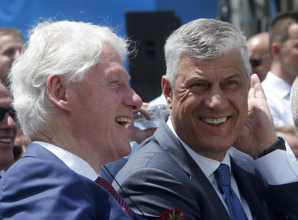 Former U.S. President Bill Clinton, left speaks with Kosovo's President Hashim Thaci during anniversary celebrations in the capital Pristina, Kosovo, Wednesday, June 12, 2019. It’s exactly 20 years since NATO forces set foot in the former Yugoslav province, after an allied bombing campaign ended Serbia’s bloody crackdown on an insurrection by the majority ethnic Albanian population in Kosovo _ revered by Serbs as their historic and religious heartland. (AP Photo/Visar Kryeziu)