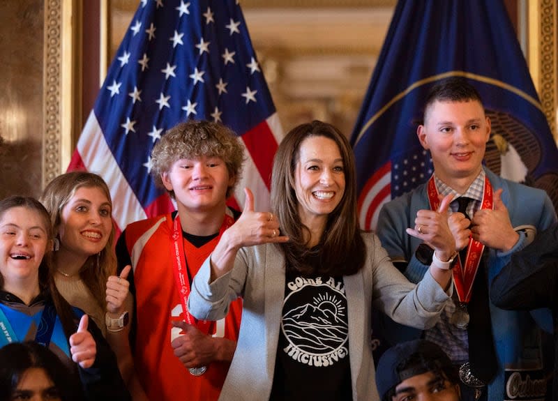 Utah first lady Abby Cox poses for a photo with high school-age Special Olympics Utah athletes at the Capitol.