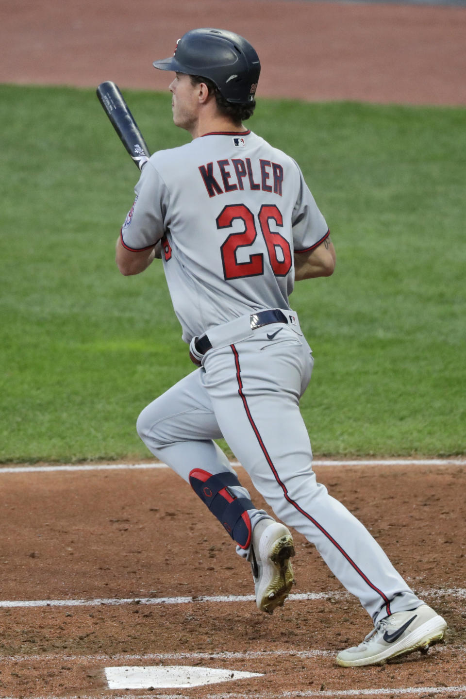 Minnesota Twins' Max Kepler watches his RBI single during the second inning of the team's baseball game against the Cleveland Indians, Tuesday, Aug. 25, 2020, in Cleveland. (AP Photo/Tony Dejak)