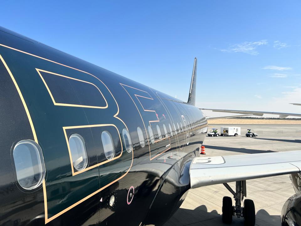 A view of the Beond logo on its black A319 as viewed from the plane's entrance