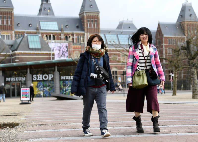 Tourists are confronted with a closed Rijksmuseum because of the coronavirus outbreak