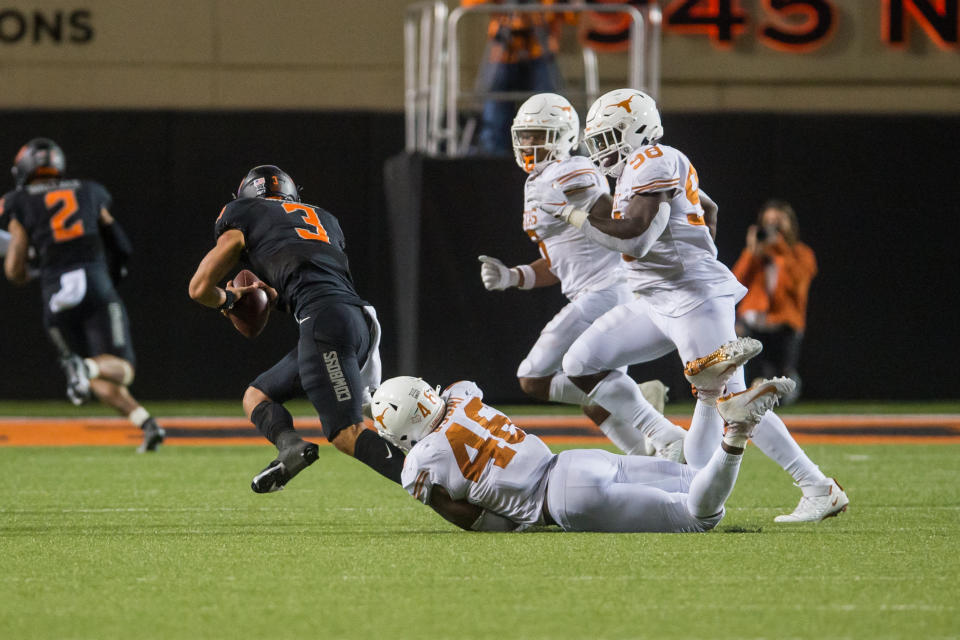 Texas EDGE Joseph Ossai logs one of his three sacks against Oklahoma State. (Brett Rojo-USA TODAY Sports)