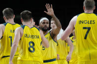 Australia's Patty Mills (5) celebrates with teammates during a men's basketball quarterfinal round game against Argentina at the 2020 Summer Olympics, Tuesday, Aug. 3, 2021, in Saitama, Japan. (AP Photo/Eric Gay)
