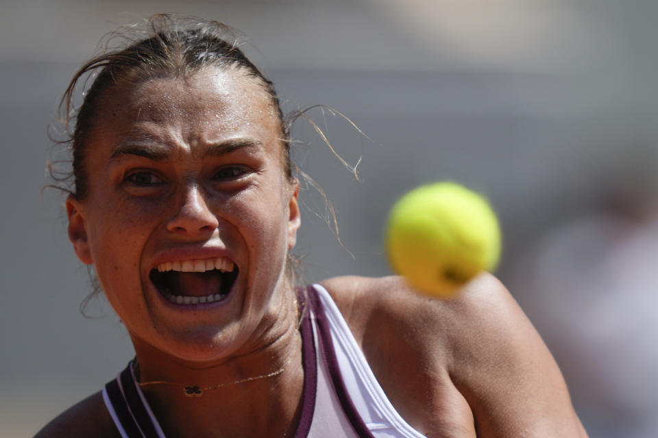 Aryna Sabalenka of Belarus eyes the ball as she plays a shot against Russia's Kamilla Rakhimova during their third round match of the French Open tennis tournament at the Roland Garros stadium in Paris, Friday, June 2, 2023. (AP Photo/Thibault Camus)