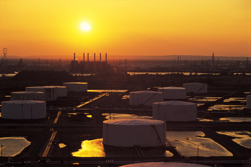 Oil storage tanks at sunset.