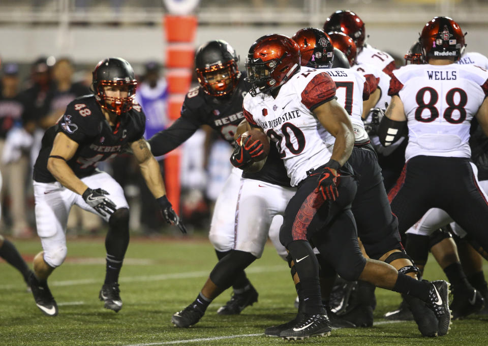 San Diego State’s Rashaad Penny (20) runs the ball against UNLV during an NCAA college football game in Las Vegas on Saturday, Oct. 7, 2017. (Chase Stevens/Las Vegas Review-Journal via AP)