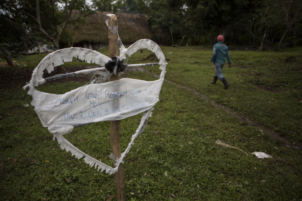A heart constructed out of wood and wrapped in plastic announces the death of 7-year-old Jakelin Amei Rosmey Caal, who died in U.S. Border Patrol custody, in her hometown Raxruha, Guatemala, on Saturday, Dec. 15, 2018. Jakelin received her first pair of shoes several weeks ago, when her father said they would set out together for the United States, thousands of miles from this small indigenous community in Guatemala. (AP Photo/Oliver de Ros)