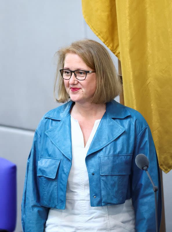 FILE PHOTO: German Family Minister Lisa Paus attends the swearing in ceremony during a session of Germany's Bundestag, in Berlin