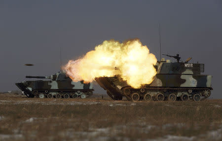 A tank of the People's Liberation Army (PLA) Marine Corps fires during a military drill at a military base in Taonan, Jilin province January 25, 2015.REUTERS/China Daily