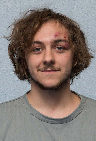 Damon Smith is seen after his arrest in an undated custody photo handed out by the Metropolitan Police and handed out after he was sentenced to 15 years for leaving a homemade bomb packed with ball bearings and shrapnel on a London underground train on its way to the Canary Wharf financial district last October in London, Britain. Metropolitan Police handout via REUTERS