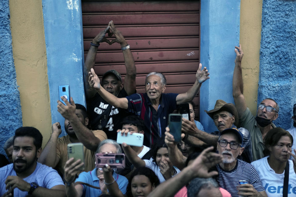 Supporters of opposition presidential hopeful Maria Corina Machado cheer during a campaign rally in Valencia, Carabobo State, Venezuela, Thursday, Oct. 5, 2023. Venezuela´s opposition will hold a primary on Oct. 22. (AP Photo/Ariana Cubillos)