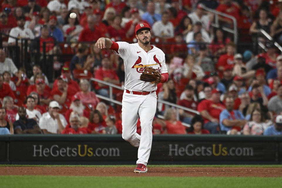 St. Louis Cardinals third baseman Nolan Arenado throws out Cincinnati Reds' Nick Senzel at first base during the sixth inning of a baseball game Thursday, Sept. 15, 2022, in St. Louis. (AP Photo/Joe Puetz)