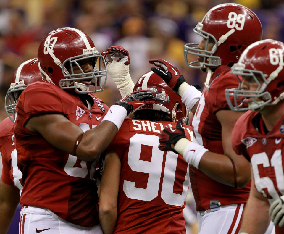 NEW ORLEANS, LA - JANUARY 09: Jeremy Shelley #90 of the Alabama Crimson Tide celebrates with his team after kicking a field goal in the second quarter against the Louisiana State University Tigers during the 2012 Allstate BCS National Championship Game at Mercedes-Benz Superdome on January 9, 2012 in New Orleans, Louisiana. (Photo by Ronald Martinez/Getty Images)