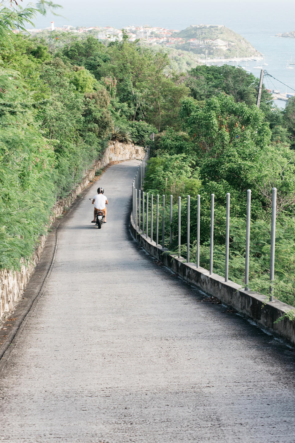 A resident rides along a local island road
