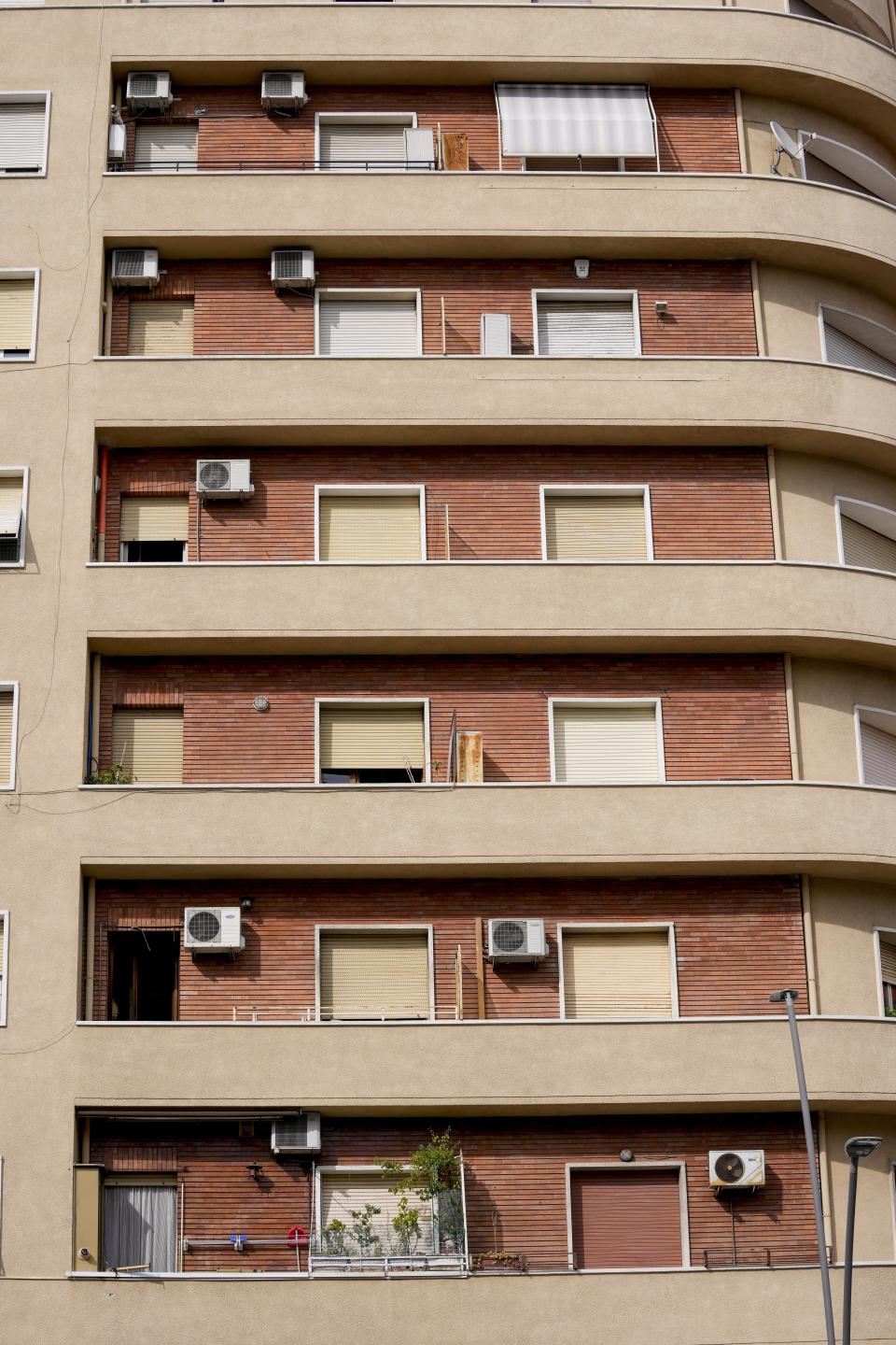 Air conditioning external units are seen on the facade of a building in Rome, Tuesday, July 25, 2023. Rising global temperatures are elevating air conditioning from a luxury to a necessity in many parts of Europe, which long has had a conflictual relationship with energy-sucking cooling systems deemed by many a U.S. indulgence. (AP Photo/Andrew Medichini)