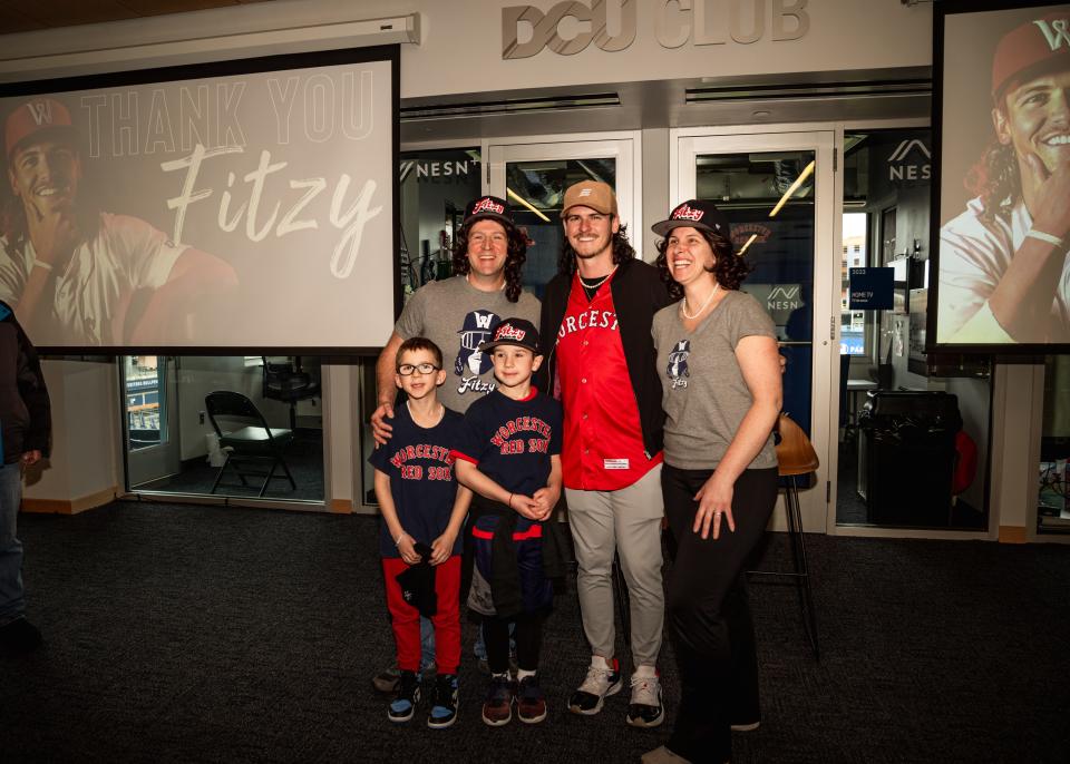 The Raby family of Maine (John, Louisa, Dexter and Derek) pose for a photo with former WooSox player Ryan Fitzgerald at “Farewell to Fitzy Day” at Polar Park on Saturday.