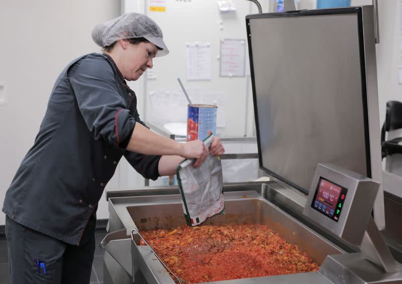 An employee prepares food at AZ Groeninge Hospital in Kortrijk