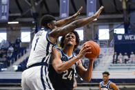 Villanova forward Jeremiah Robinson-Earl (24) looks to shoot over Butler guard Bo Hodges (1) in the first half of an NCAA college basketball game in Indianapolis, Sunday, Feb. 28, 2021. (AP Photo/Michael Conroy)