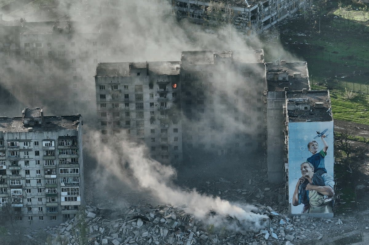  Smoke rises from a building in Bakhmut, the site of the heaviest battles with the Russian troops  (AP)