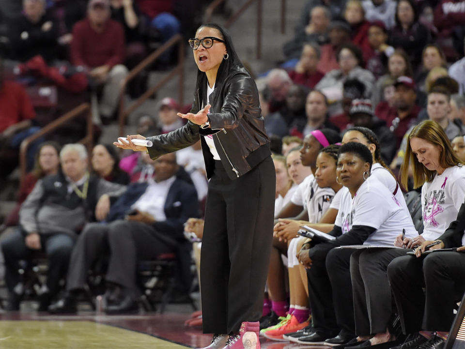 South Carolina head coach Dawn Staley, center, reacts during the first half of an NCAA college basketball game against LSU, Thursday, Feb. 20, 2020, in Columbia, S.C. (AP Photo/Richard Shiro)