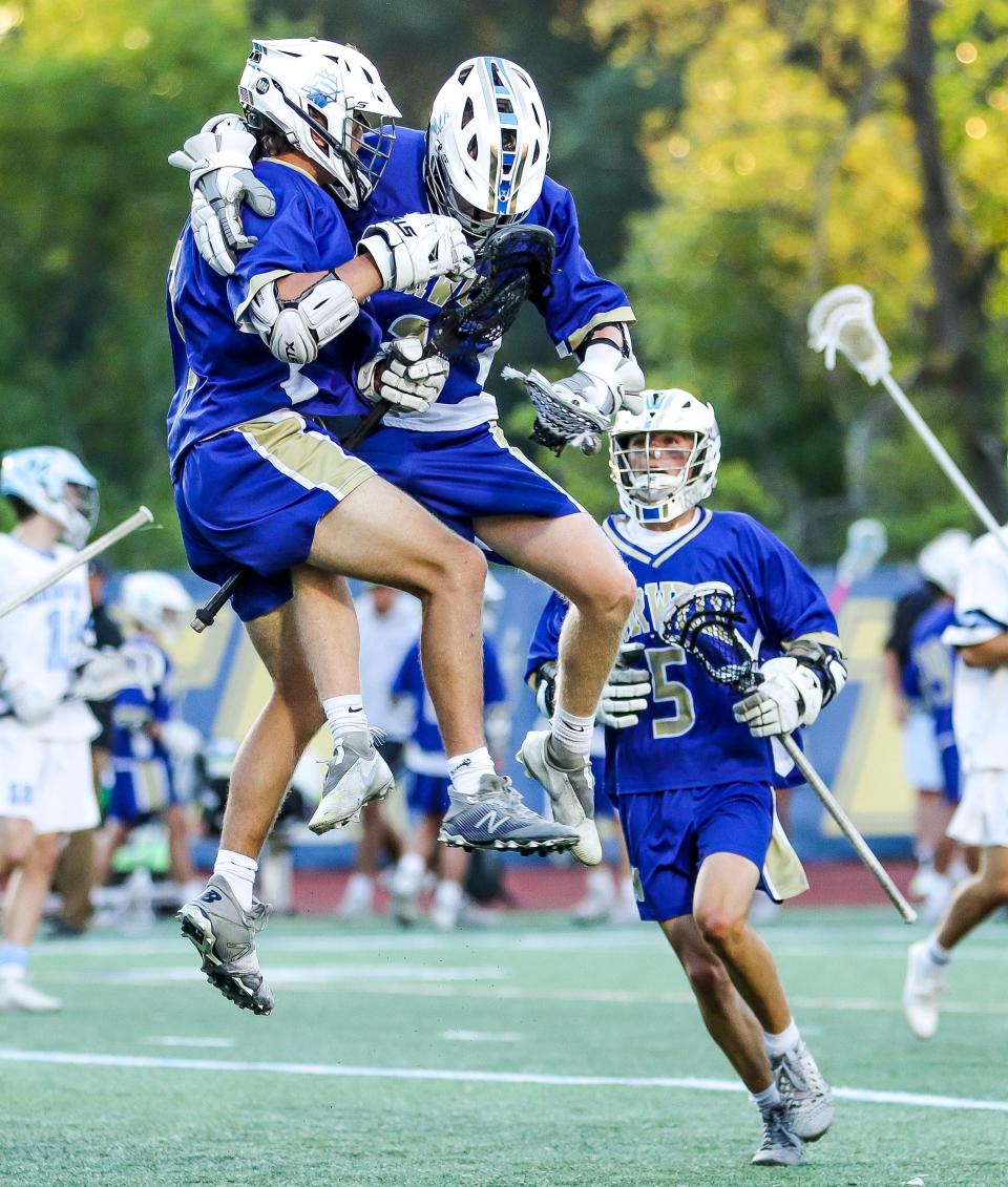 The Norwell High boys lacrosse team celebrates winning the Division 3 state title game over Medfield at Worcester State University on Wednesday, June 22, 2022.