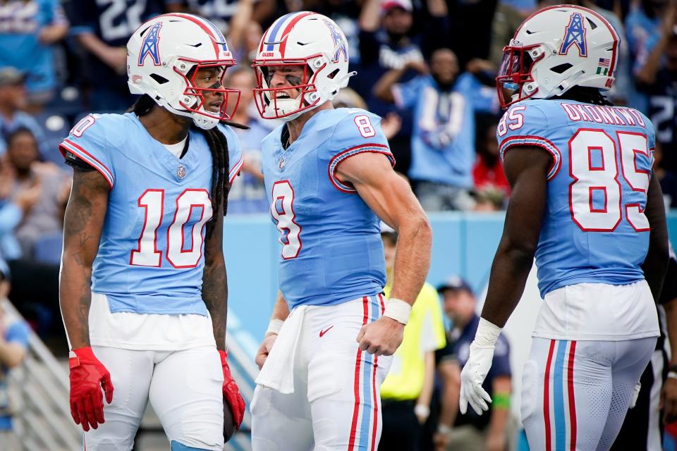 Tennessee Titans quarterback Will Levis (8) reacts after wide receiver DeAndre Hopkins (10) received a pass for a touchdown against the Atlanta Falcons during the first quarter at Nissan Stadium in Nashville, Tenn., Sunday, Oct. 29, 2023.