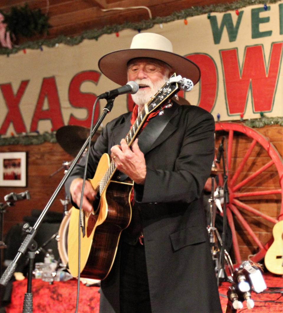 Michael Martin Murphy sings during his December visit to Pioneer Hall in Anson for the annual Texas Cowboys' Christmas Ball. The longtime entertainer has been honored by his home state again. Dec. 17 2021