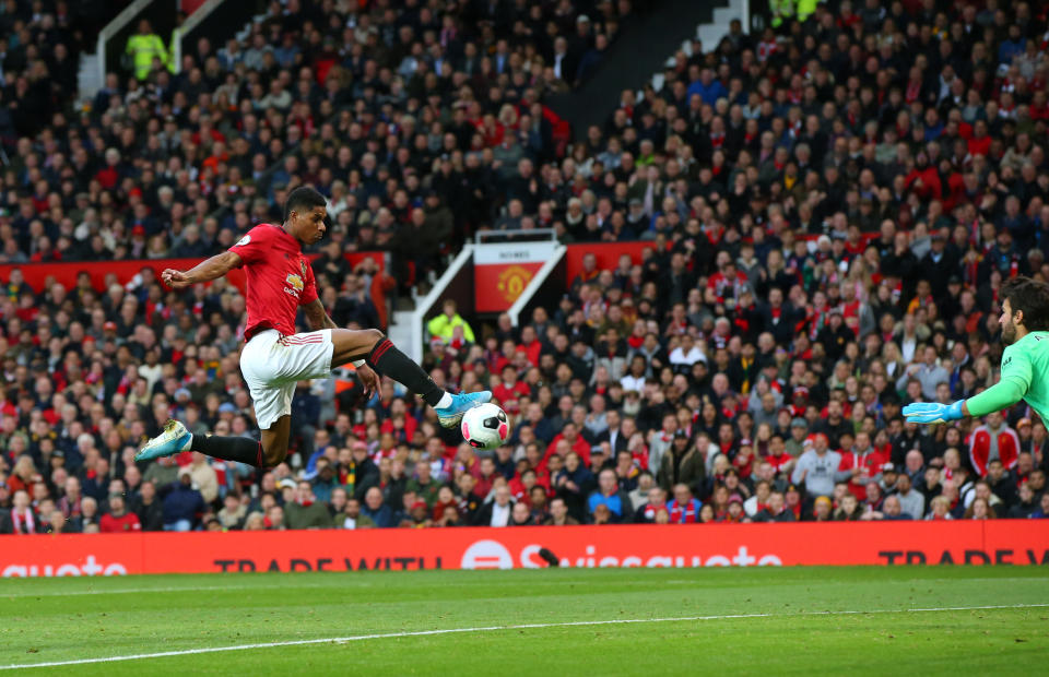 MANCHESTER, ENGLAND - OCTOBER 20: Marcus Rashford of Manchester United scores his sides first goal during the Premier League match between Manchester United and Liverpool FC at Old Trafford on October 20, 2019 in Manchester, United Kingdom. (Photo by Alex Livesey/Getty Images)