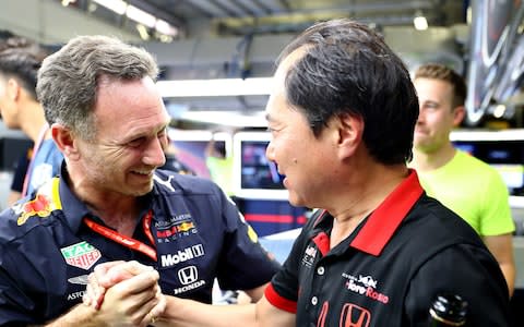 Red Bull Racing Team Principal Christian Horner and Toyoharu Tanabe of Honda celebrate the win of Max Verstappen of Netherlands and Red Bull Racing in the garage after the F1 Grand Prix of Austria at Red Bull Ring on June 30, 2019 in Spielberg, Austria - Credit: Getty Images