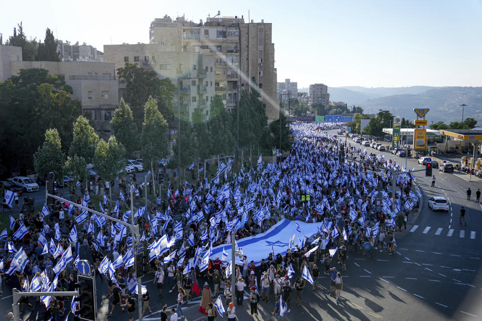 Thousands of Israelis march to Jerusalem in protest of plans by Prime Minister Benjamin Netanyahu's government to overhaul the judicial system, in Jerusalem, Saturday, July 22, 2023. Thousands of demonstrators entered the last leg of a four-day and nearly 70-kilometer (roughly 45-mile) trek from Tel Aviv to Jerusalem. Protest organizers planned to camp overnight outside Israel's parliament on Saturday. (AP Photo/Ohad Zwigenberg)